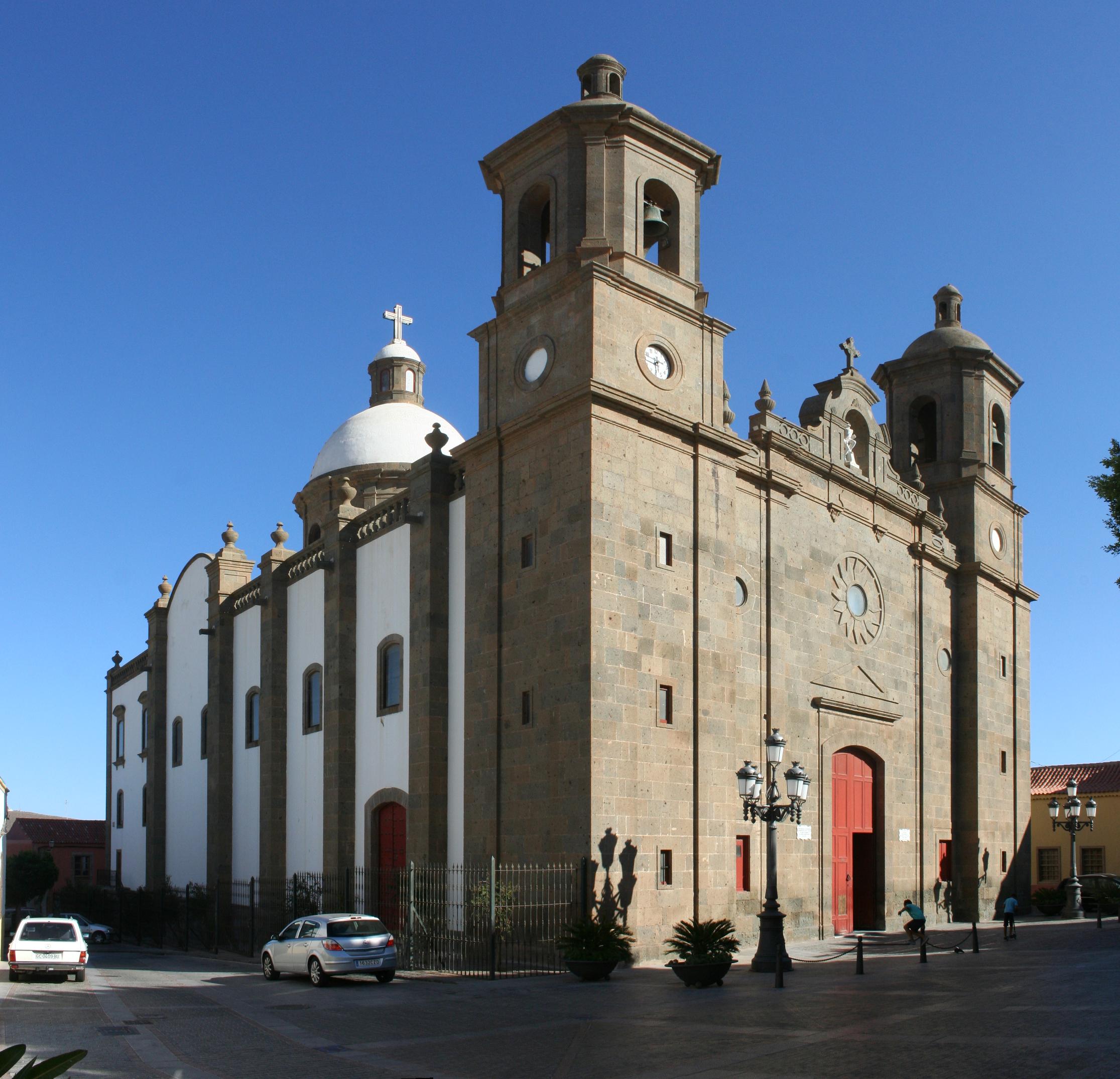 The historic parish church in Aguimes Old Town features distinctive twin towers and a white dome topped with a cross.