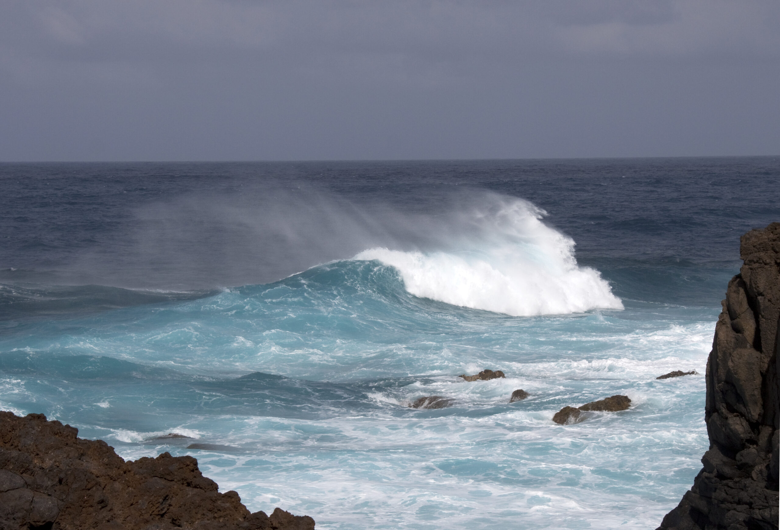 Powerful Atlantic swells crash against the rugged rocks of La Palma's Barlovento Coast.