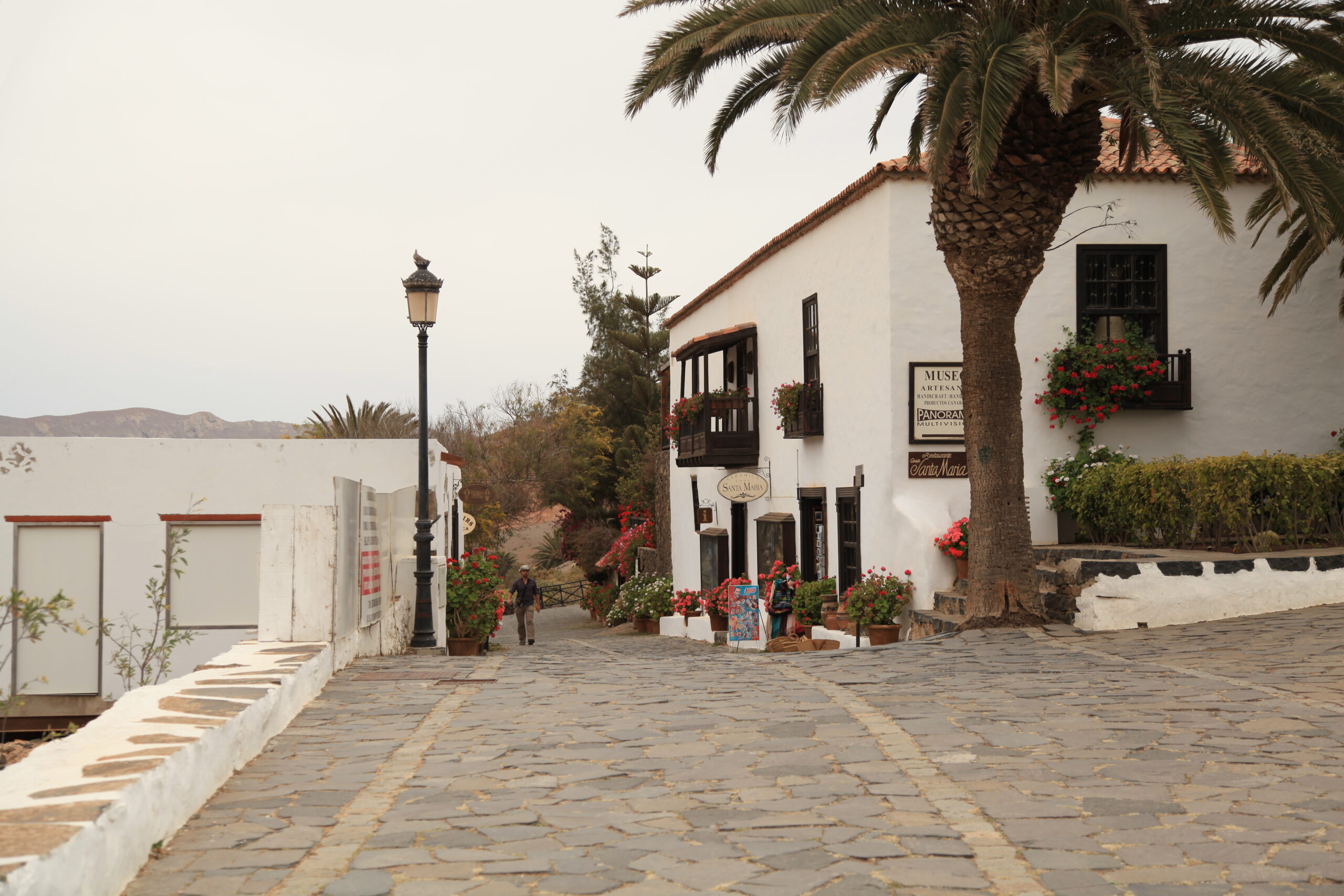 Historic colonial architecture in Betancuria's old town, featuring traditional whitewashed walls and Mediterranean-style design overlooking the island's coastline.