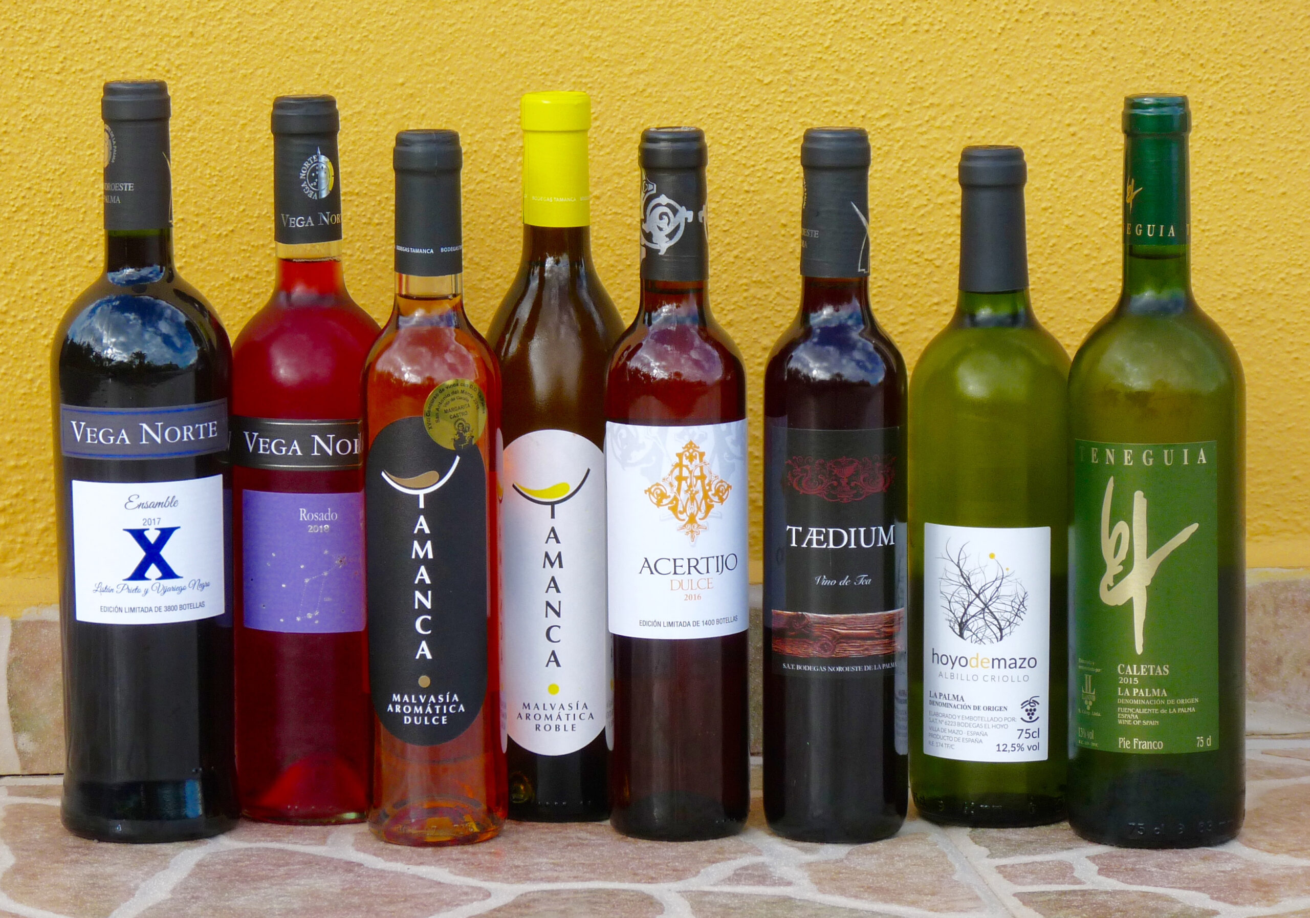 A selection of Canarian wines representing various denominaciones de origen, showcasing the diversity of local production.