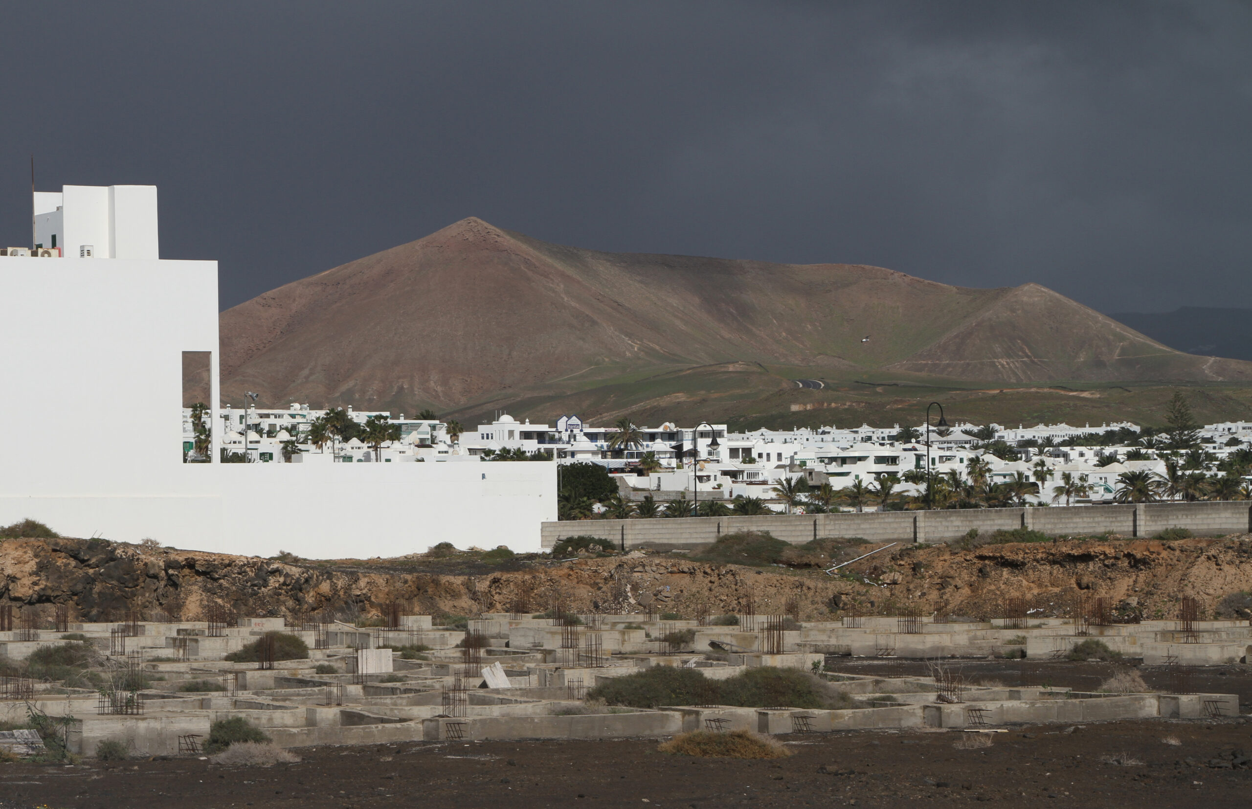 Costa Teguise's whitewashed architecture frames views of the volcanic landscape that characterizes Lanzarote's interior.