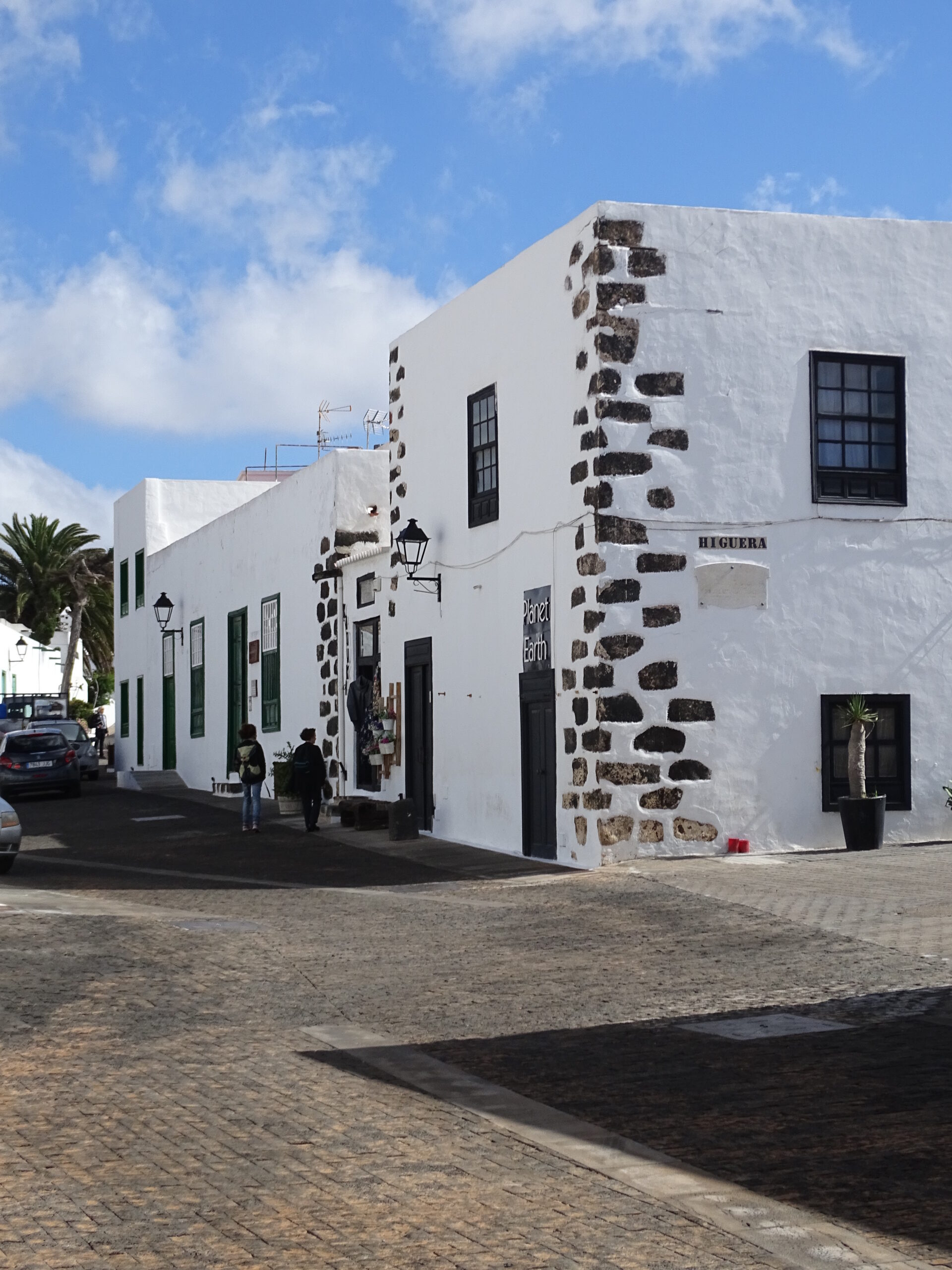 Traditional Canarian architecture in Costa Teguise Village, featuring the distinctive white walls and dark lava stone details characteristic of Lanzarote's design.