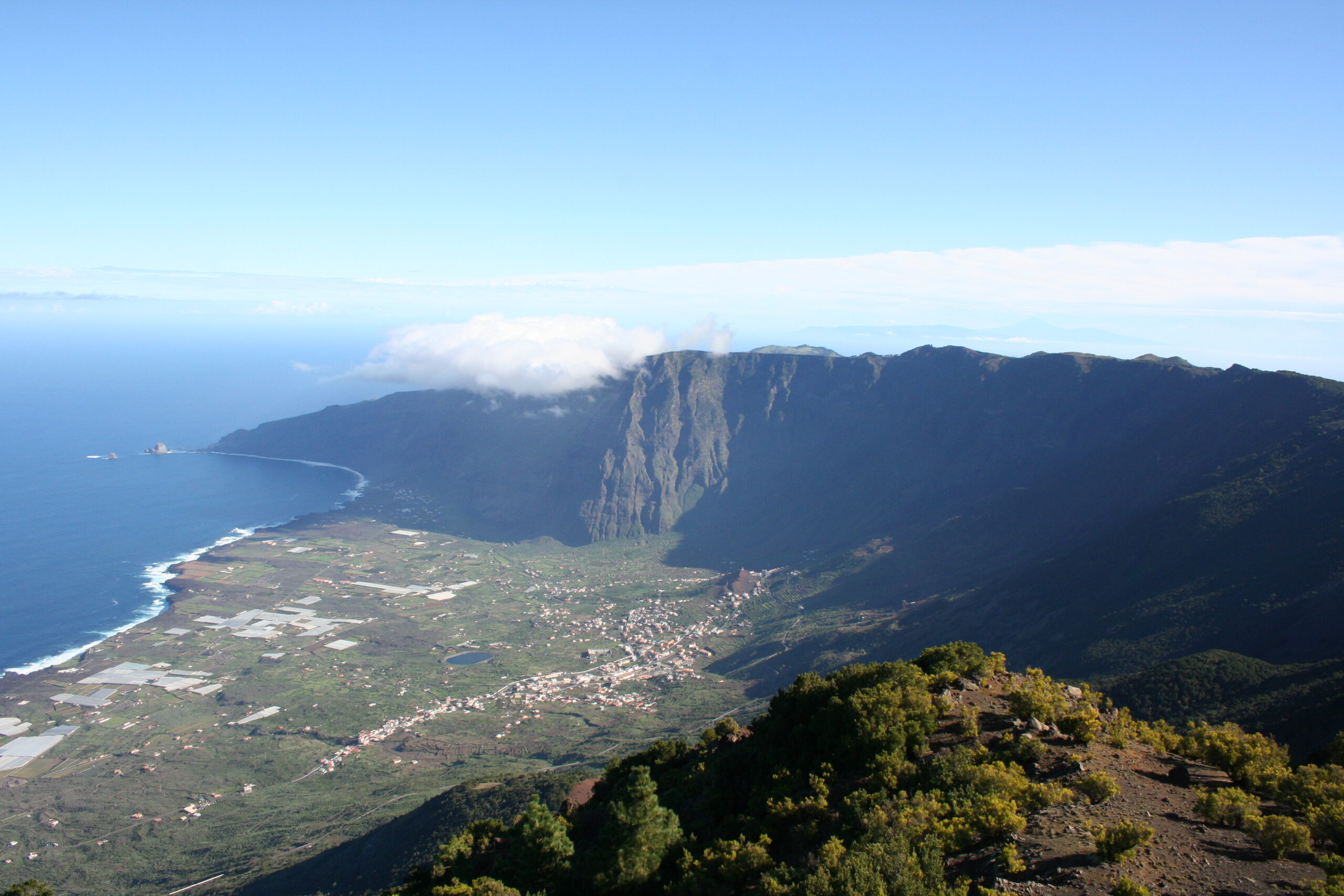 The dramatic valley of Frontera in El Hierro, with its distinctive vertical cliffs and fertile lowlands meeting the sea.