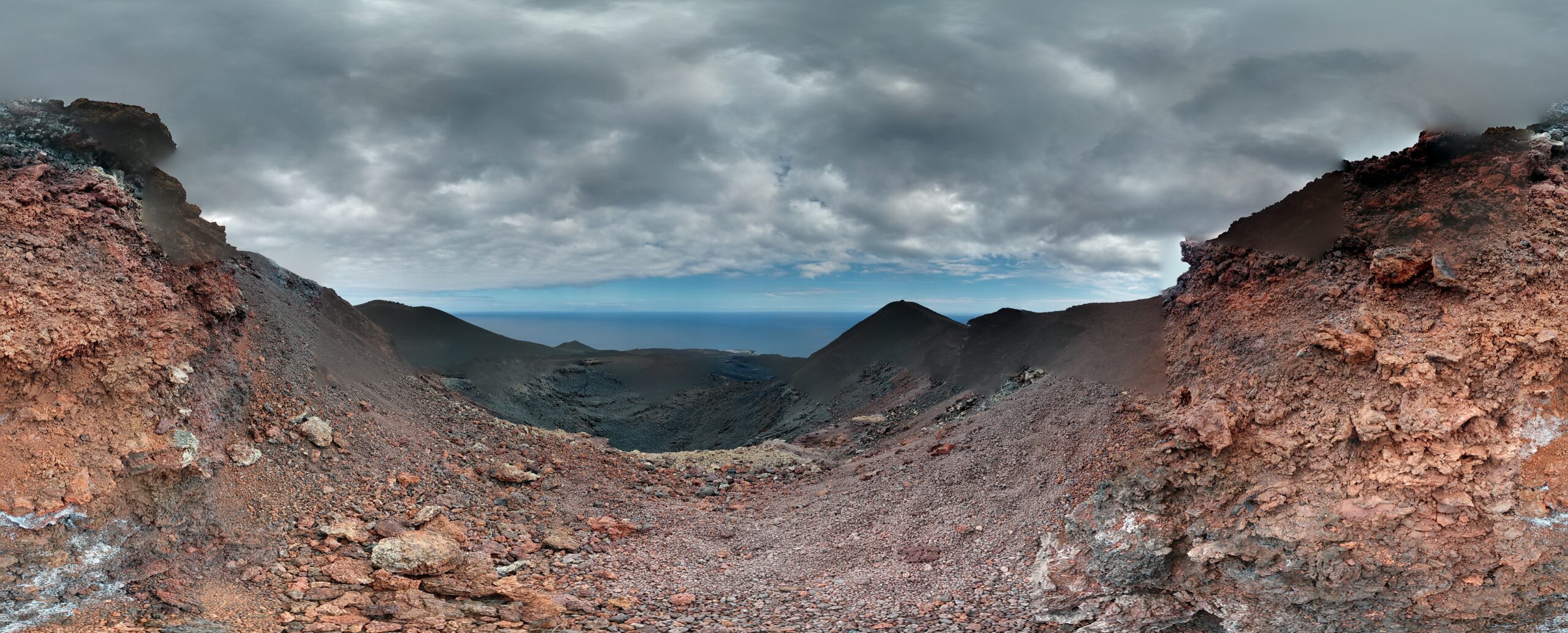 The dramatic volcanic landscape of Fuencaliente features distinctive cinder cones and expansive lava fields with views toward the sea.