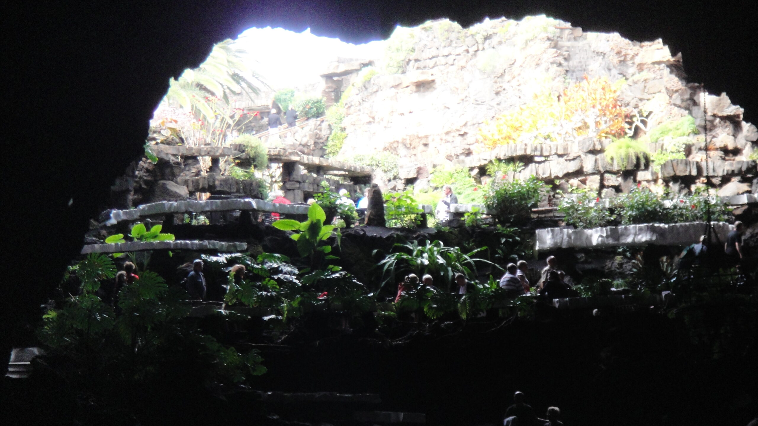 The striking natural cavern at Jameos del Agua features a dramatic skylight opening and landscaped gardens within the volcanic cave.