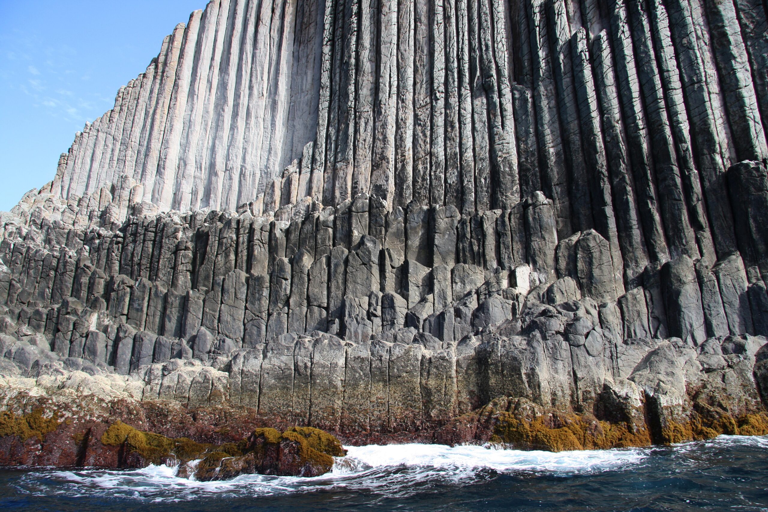 The dramatic basalt organ pipes of Los Órganos rise directly from the Atlantic, their distinctive hexagonal columns formed by ancient volcanic activity.