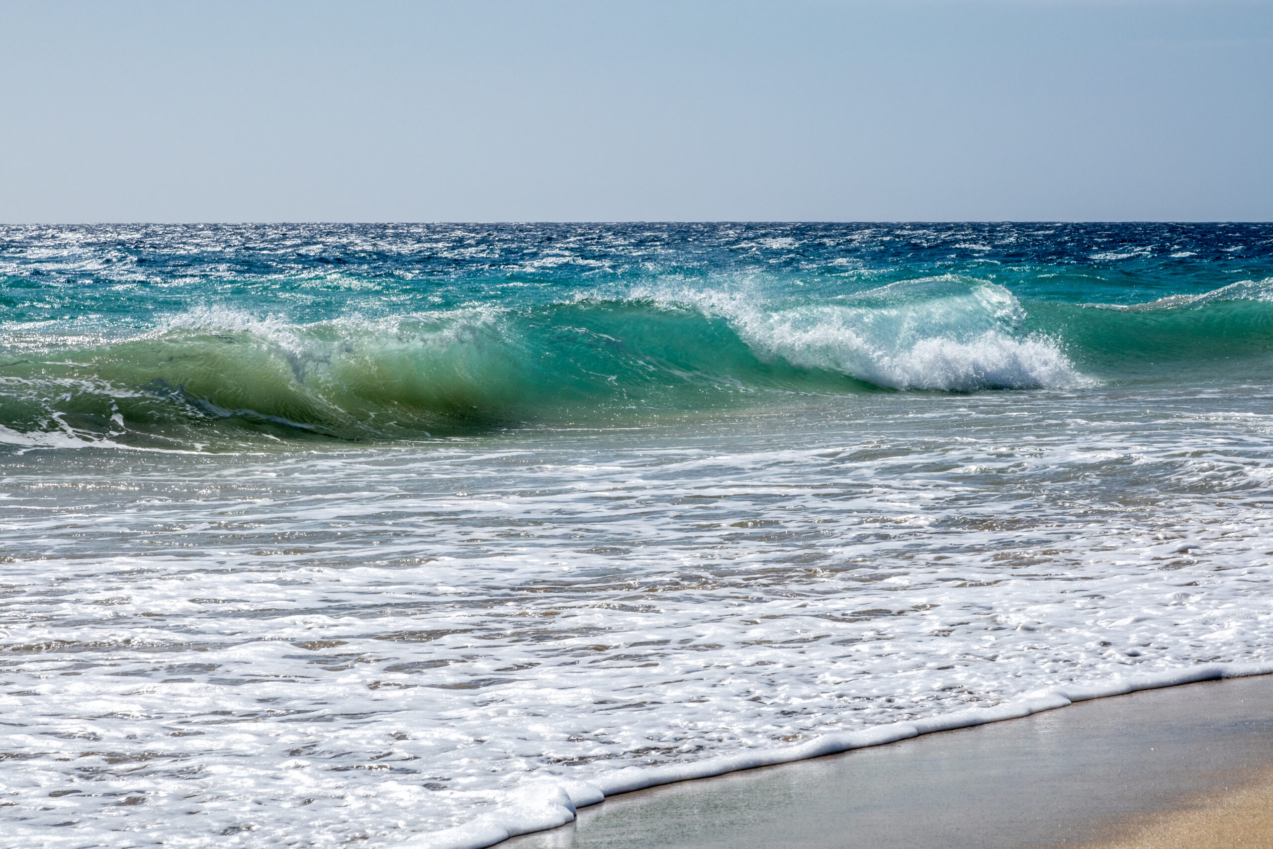 The Atlantic coast near Morro Jable offers dramatic ocean swells and pristine sandy beaches.