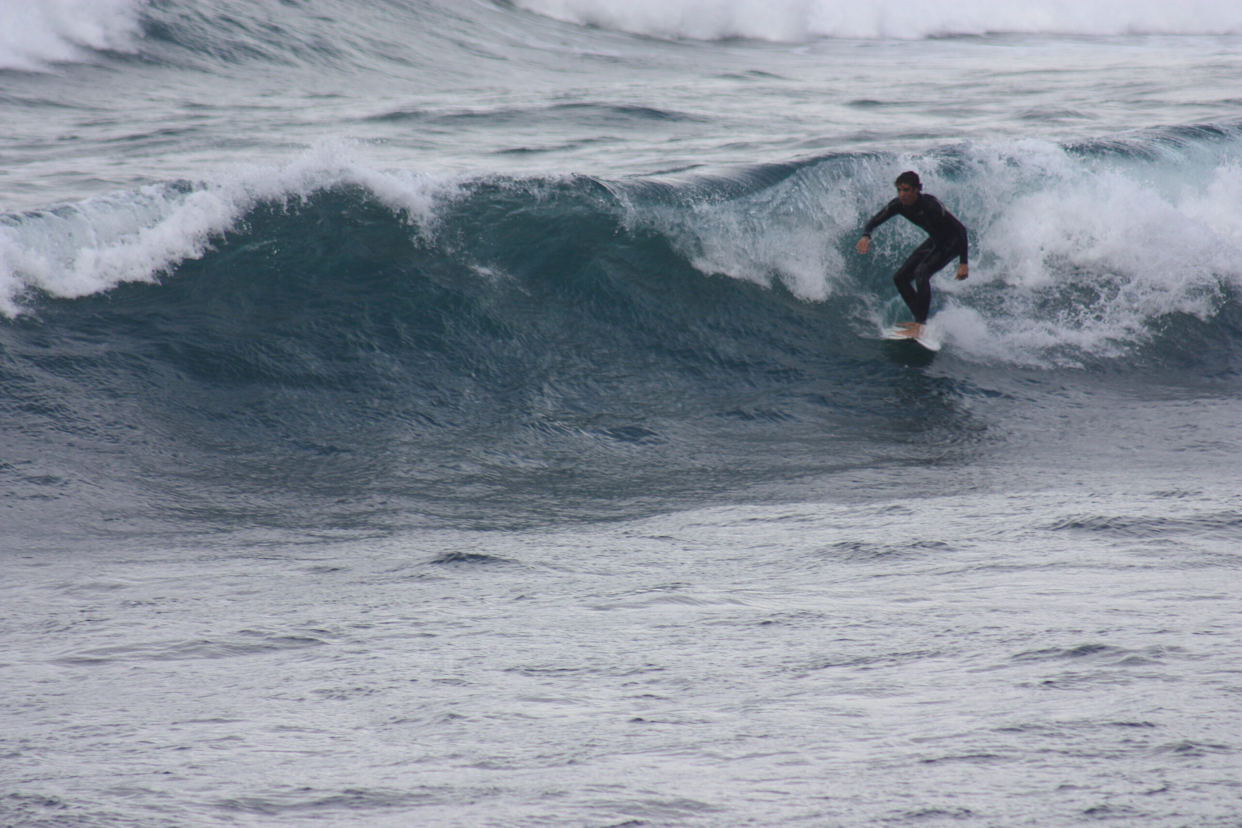 Playa Famara's consistent Atlantic swells attract surfers year-round to this popular beach break on Lanzarote's north coast.