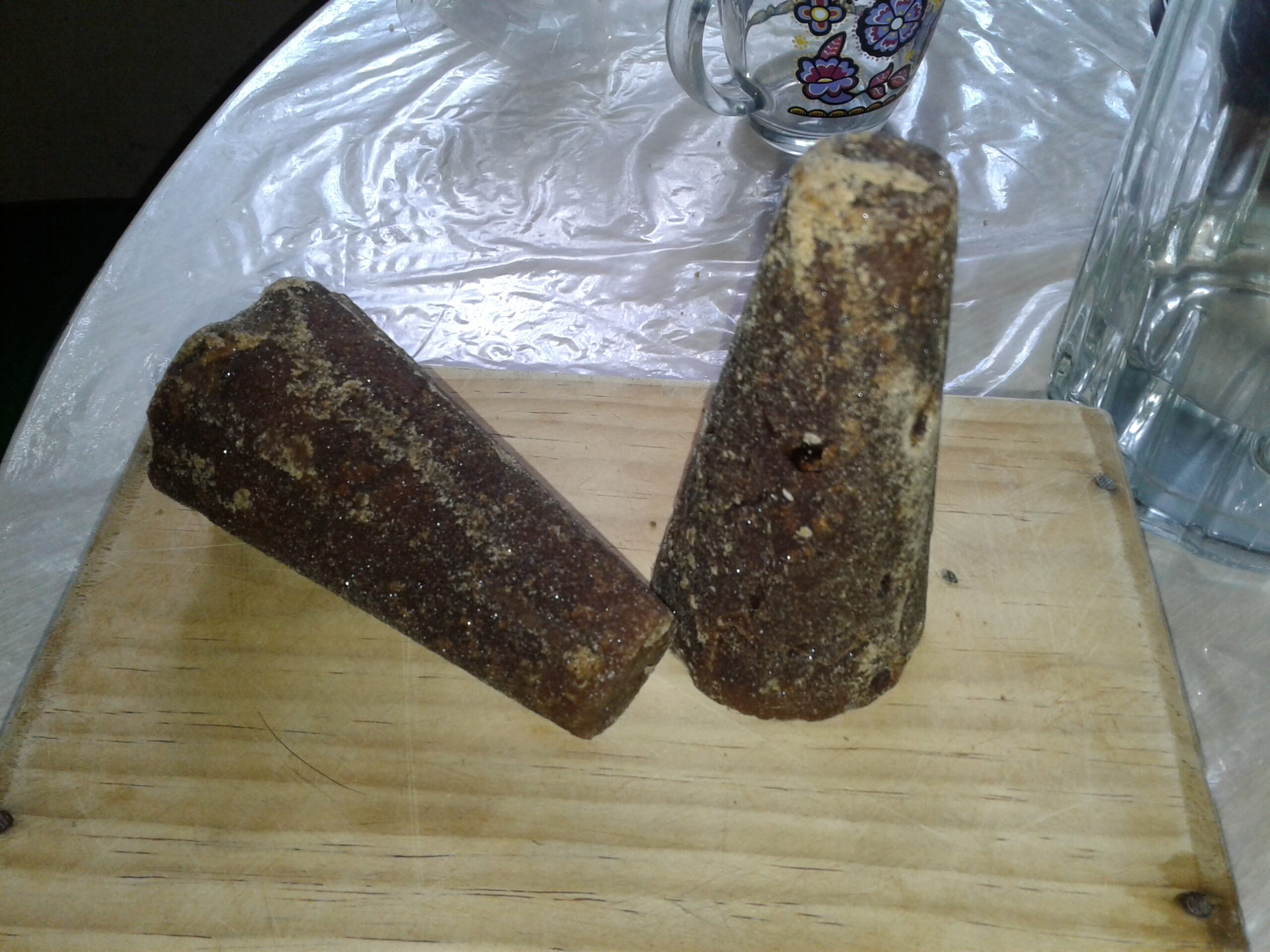 Traditional Canarian rapadura, a dense molasses-based candy rolled in sugar and formed into characteristic cylindrical shapes.