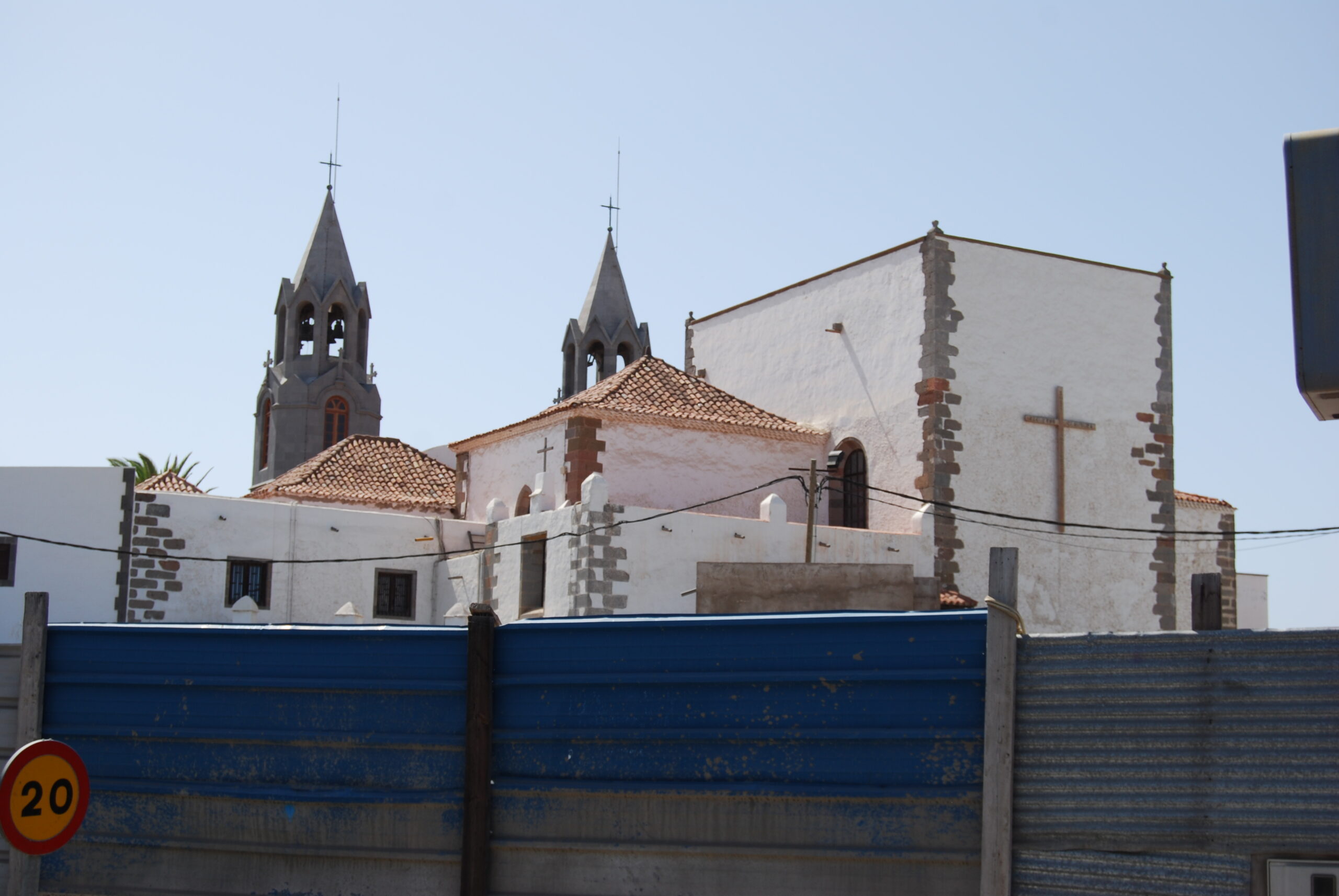 San Juan Church in Telde features distinctive twin spires and traditional Canarian colonial architecture with volcanic stone accents.