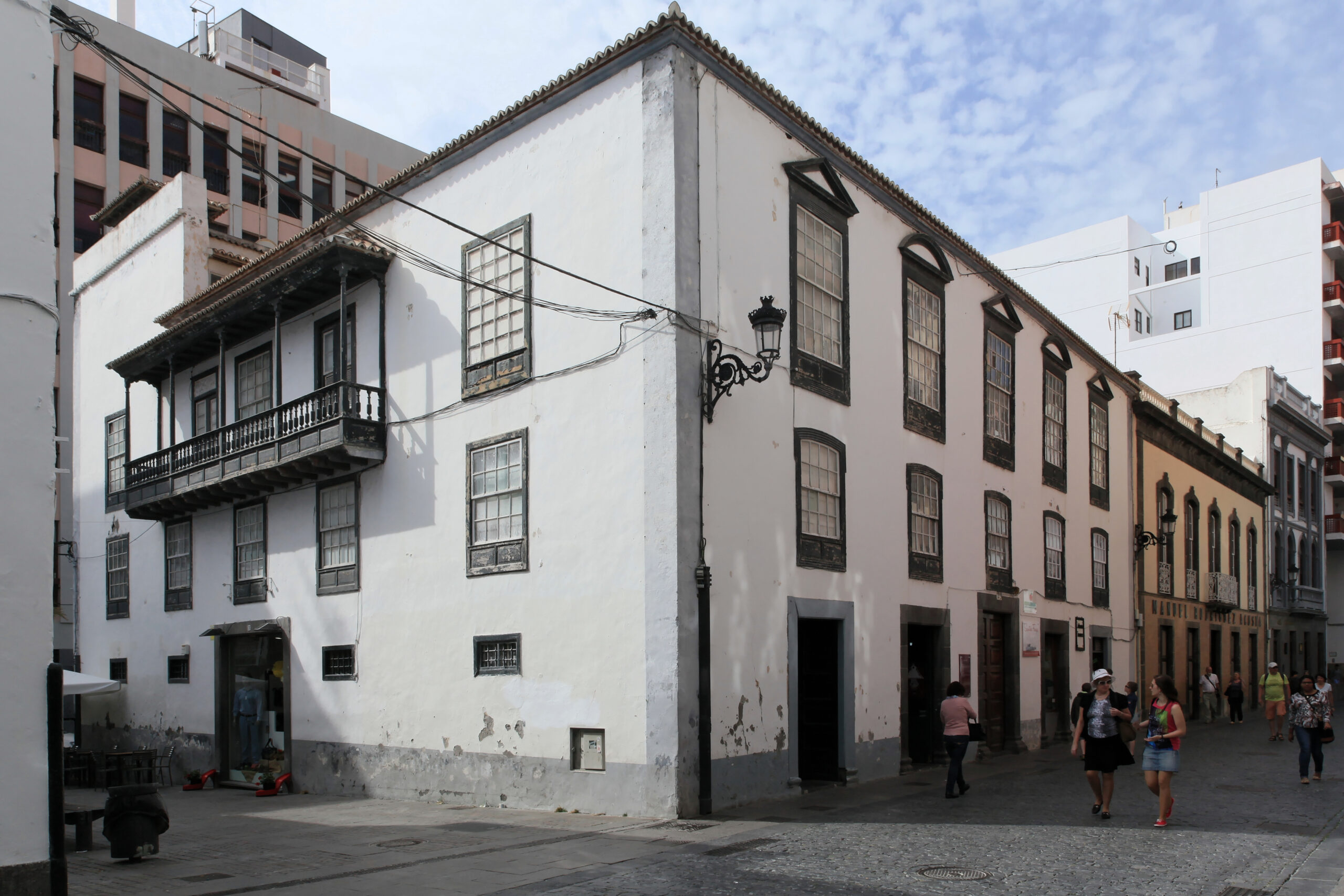 Historic colonial architecture in Santa Cruz Old Town, featuring traditional Canarian-style buildings with characteristic wooden balconies and shutters.