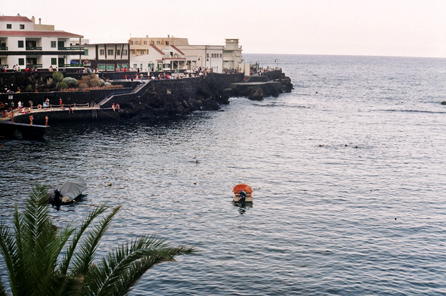 Tamaduste's sheltered natural swimming pool, formed by volcanic rock formations, offers calm waters ideal for bathing just offshore from the village.