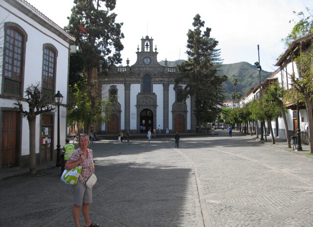 The main plaza of Teror Old Town blends whitewashed colonial architecture with the distinctive dark-stone basilica at its centre.