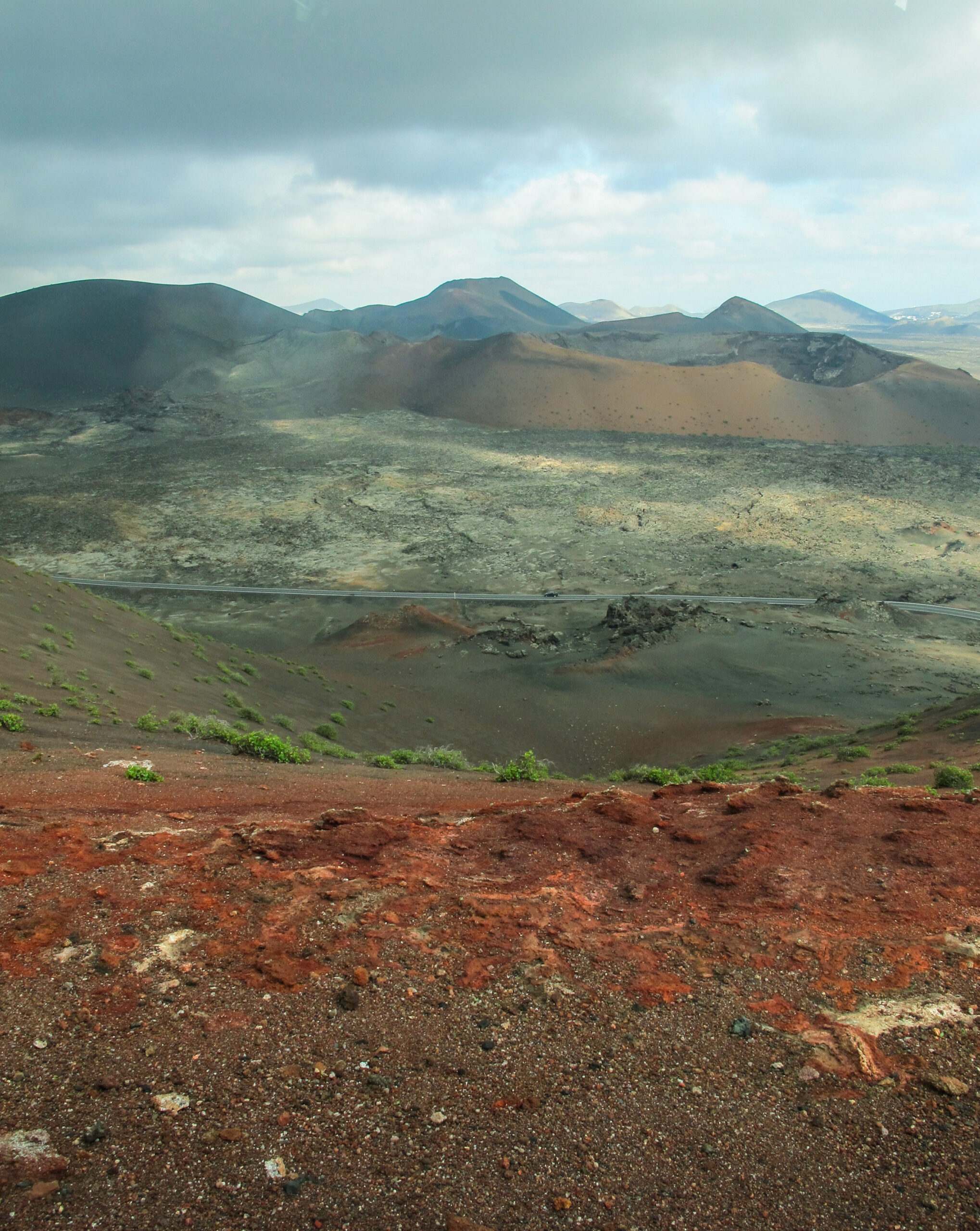 The dramatic volcanic terrain of Timanfaya National Park showcases stark cinder cones and ancient lava flows across Lanzarote's volcanic heartland.